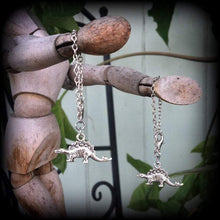 Load image into Gallery viewer, Dinosaur tunnel dangles 4 gauge weights 4mm Gauged earrings Stegosaurus 6mm ear hangers Hanging gauges Reptile jewelry 5mm plug dangles 2g