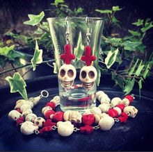 Load image into Gallery viewer, Skull earrings, Voodoo earrings, Los Muertos earrings, Santeria jewelry, Plug earrings, Tunnel earrings, Red inverted cross, Pierced ears